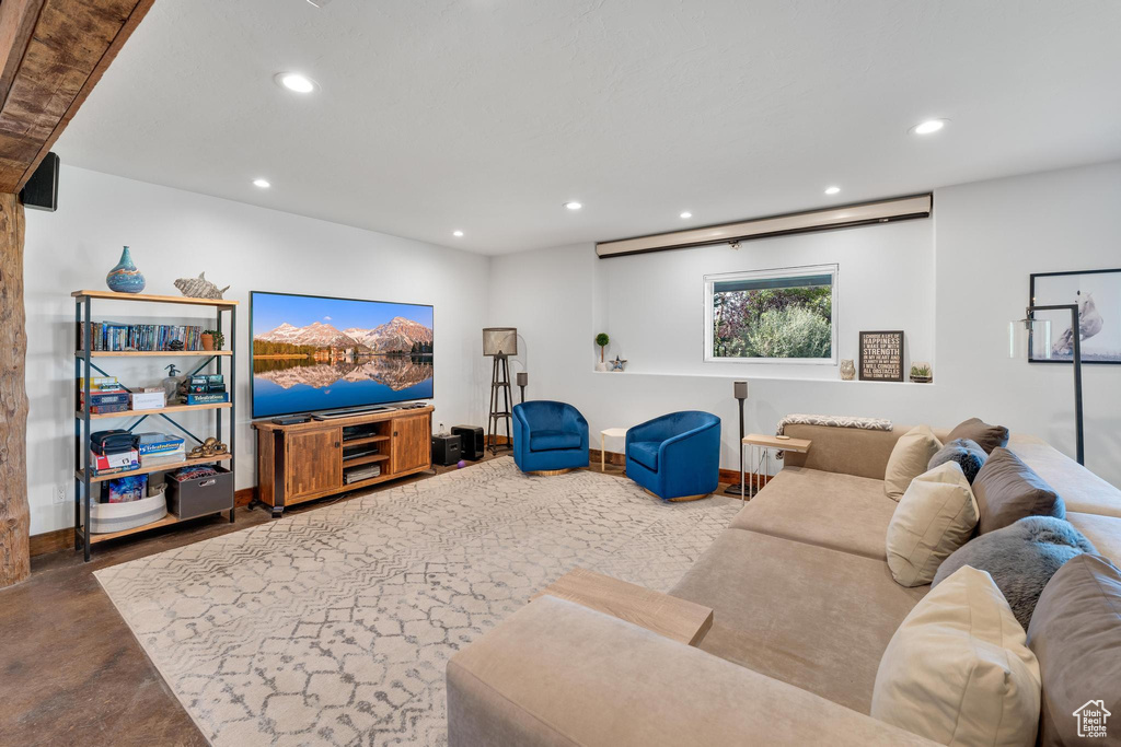 Living room featuring concrete flooring