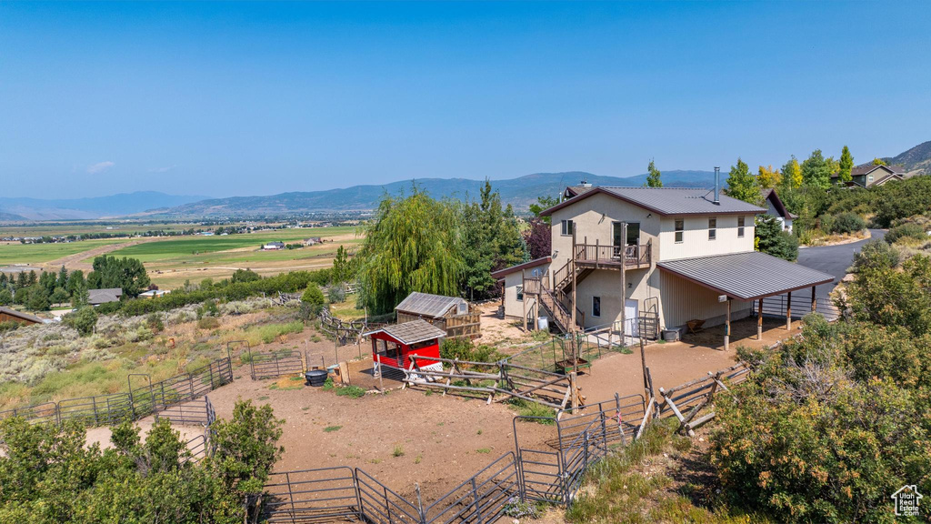 Drone / aerial view with a rural view and a mountain view