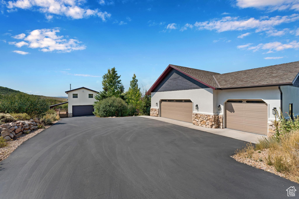 View of front facade featuring a garage