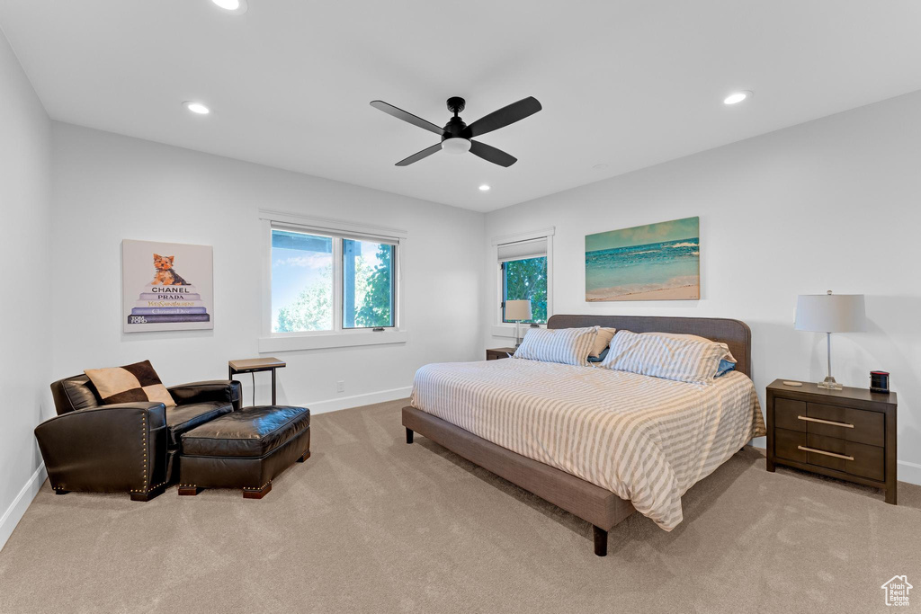 Bedroom featuring ceiling fan and light carpet