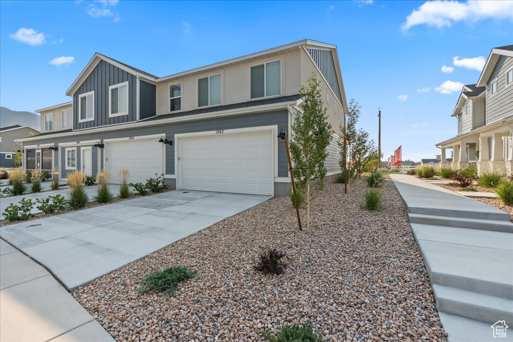 View of front of property with a garage