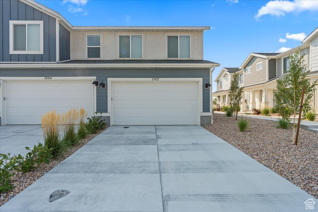 View of front of property featuring a garage