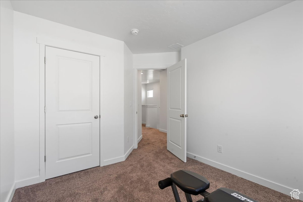 Exercise area featuring carpet floors