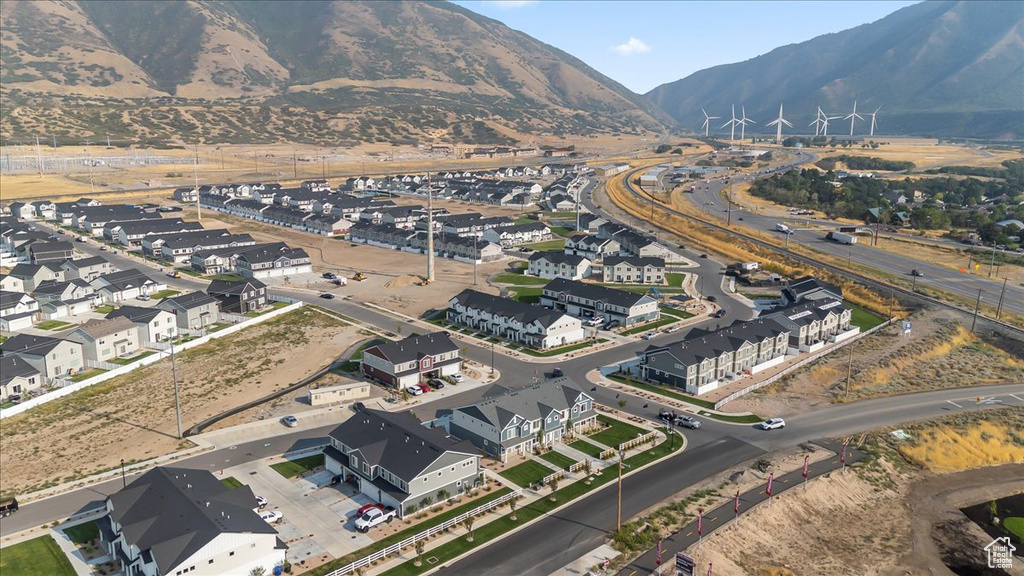 Birds eye view of property with a mountain view