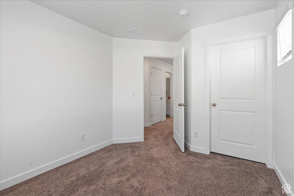 Unfurnished bedroom featuring carpet floors