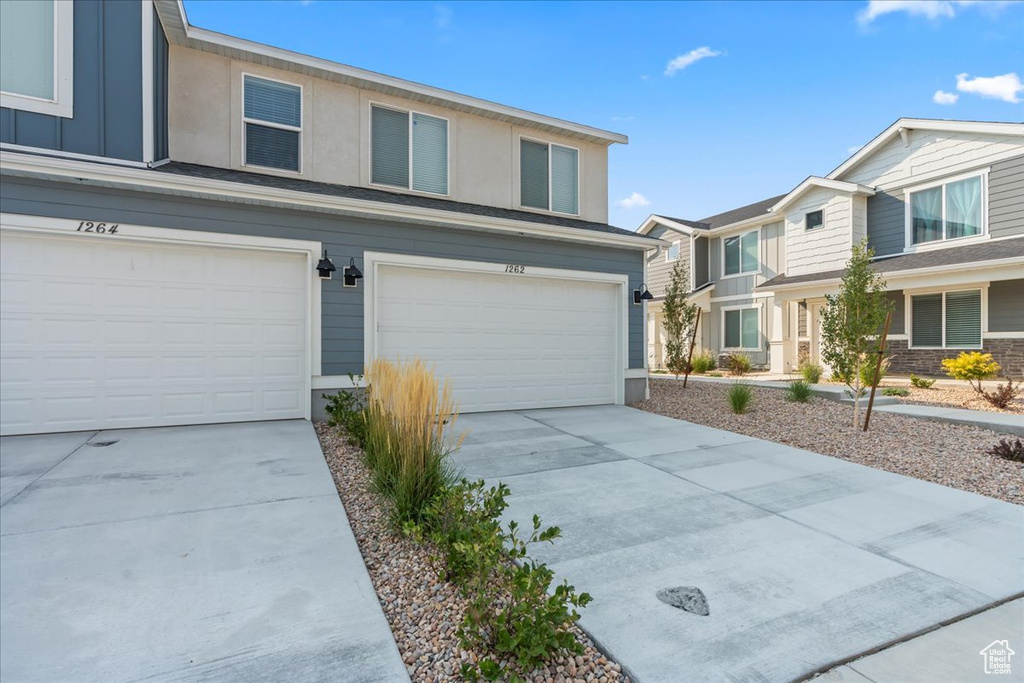 View of front of home featuring a garage