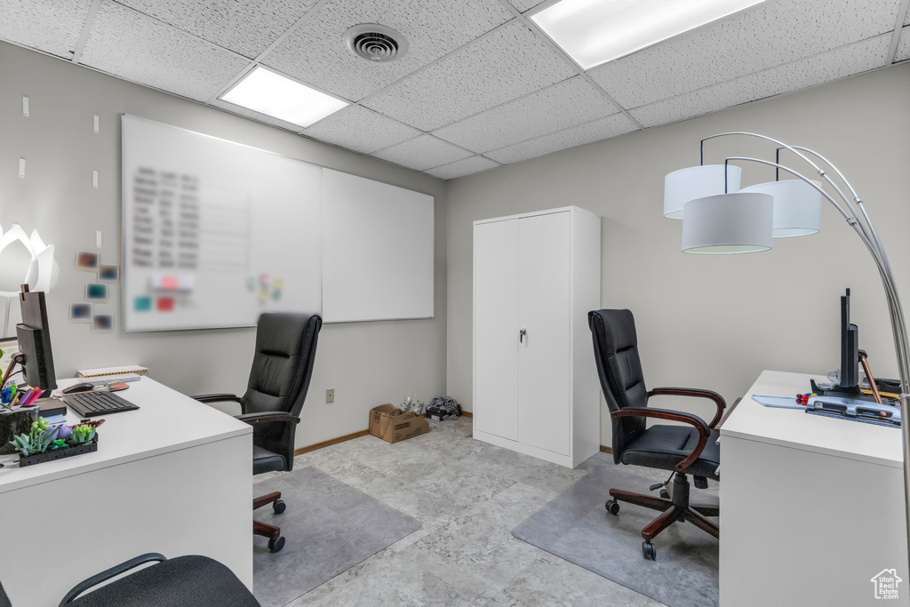 Office with a paneled ceiling