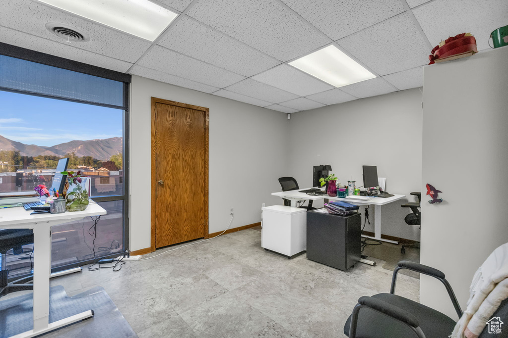Home office featuring a paneled ceiling and a mountain view