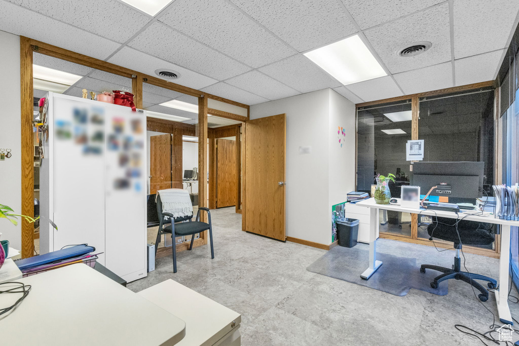 Office featuring a drop ceiling