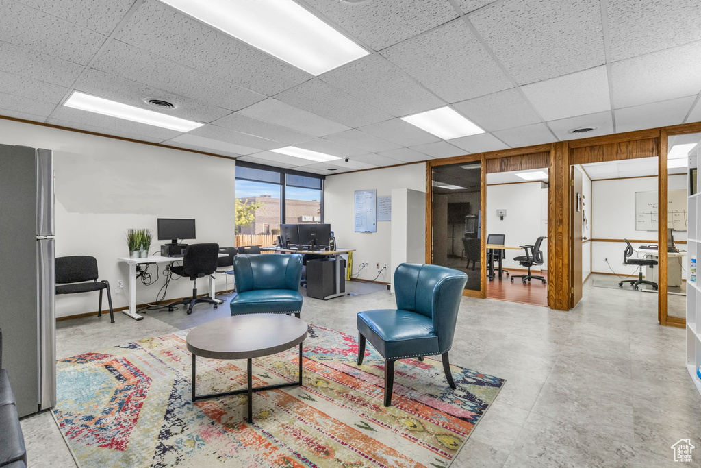 Living room featuring a paneled ceiling
