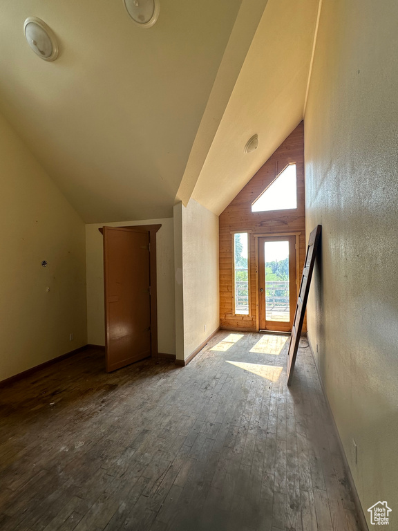 Additional living space featuring vaulted ceiling and hardwood / wood-style floors