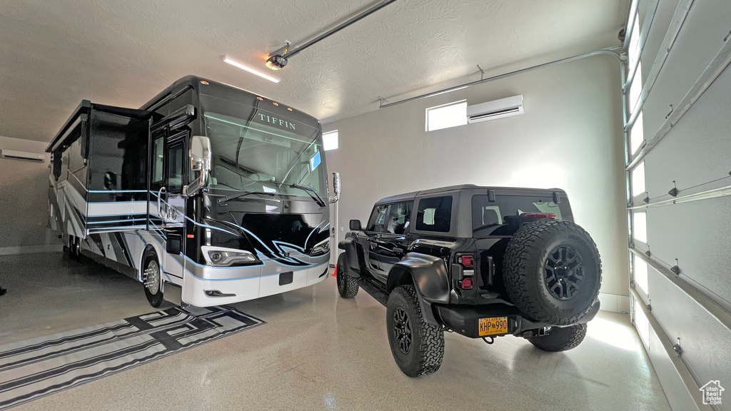 Garage featuring an AC wall unit