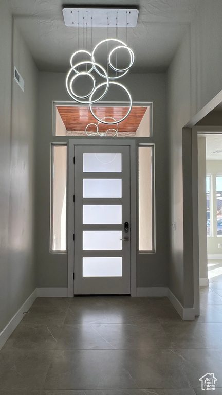 Foyer entrance with an inviting chandelier