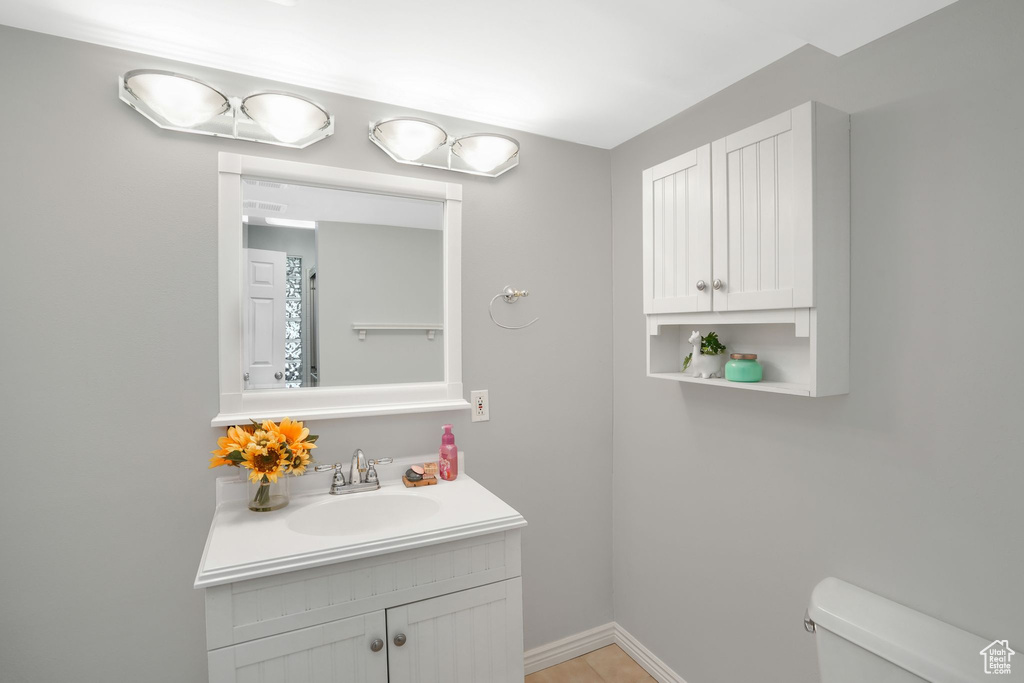 Bathroom with toilet and vanity