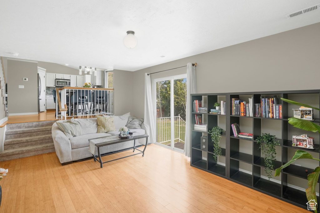 Living room with light wood-type flooring