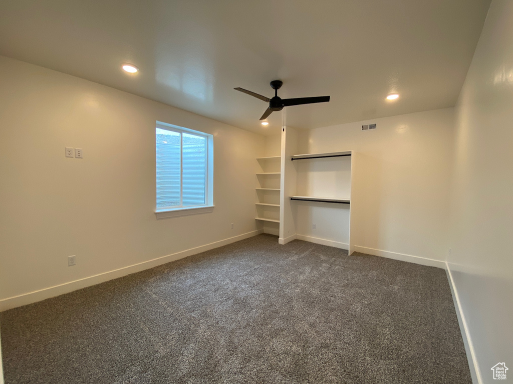 Unfurnished bedroom with carpet flooring and ceiling fan