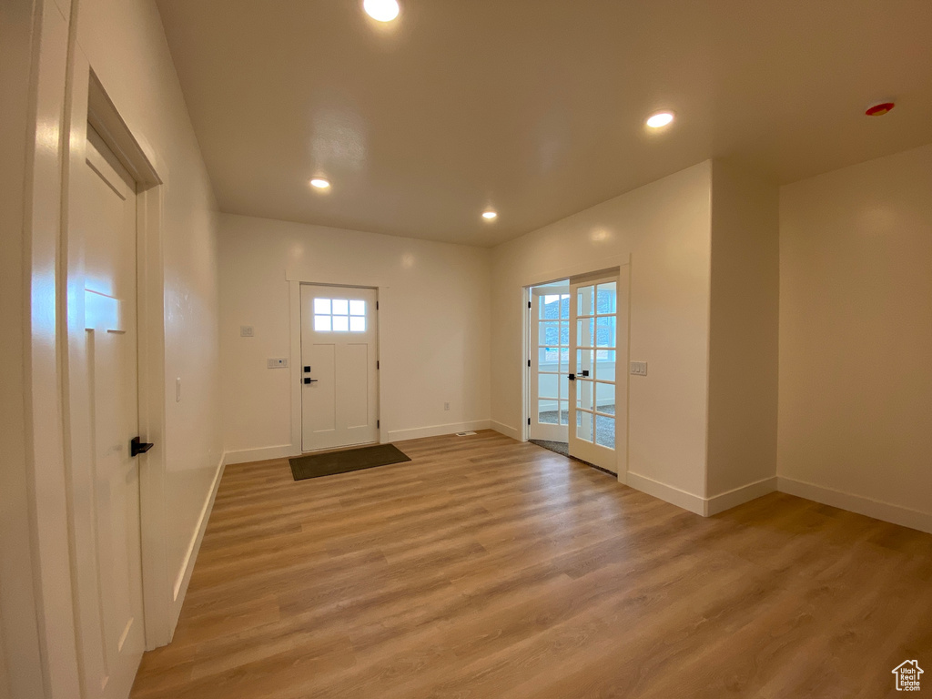 Doorway to outside featuring wood-type flooring