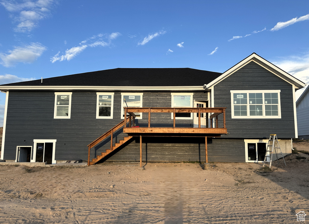 View of front facade featuring a wooden deck