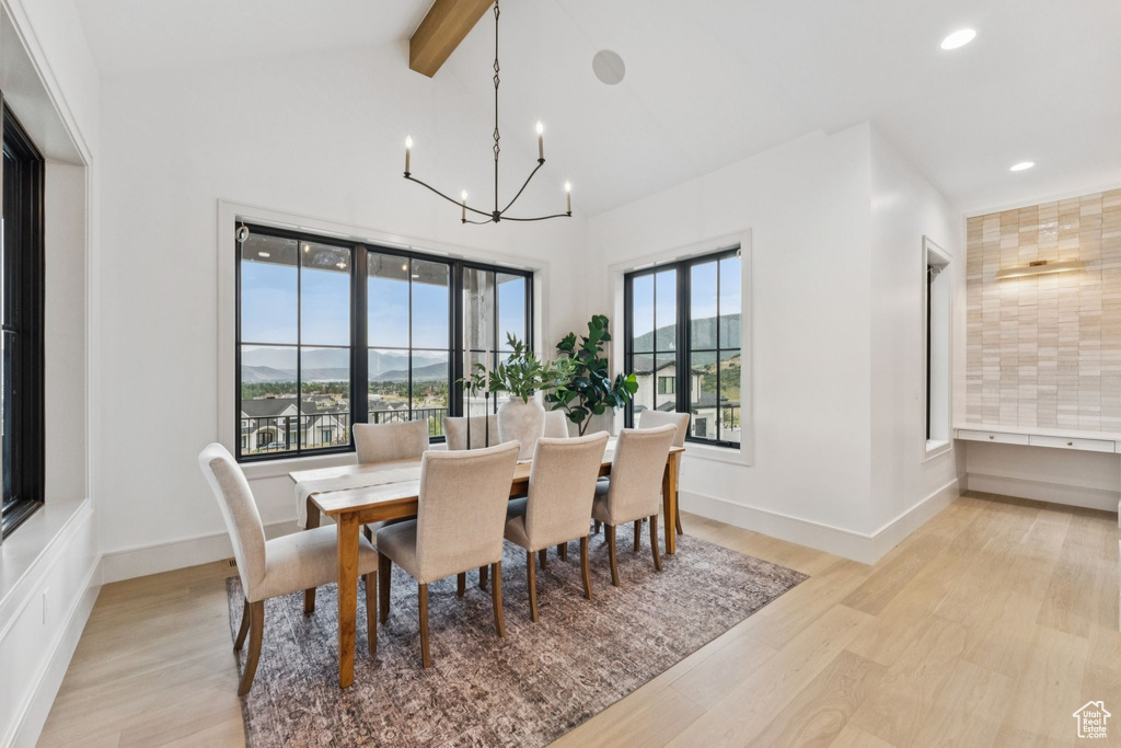Dining room featuring light wood-style flooring, a chandelier, and recessed lighting