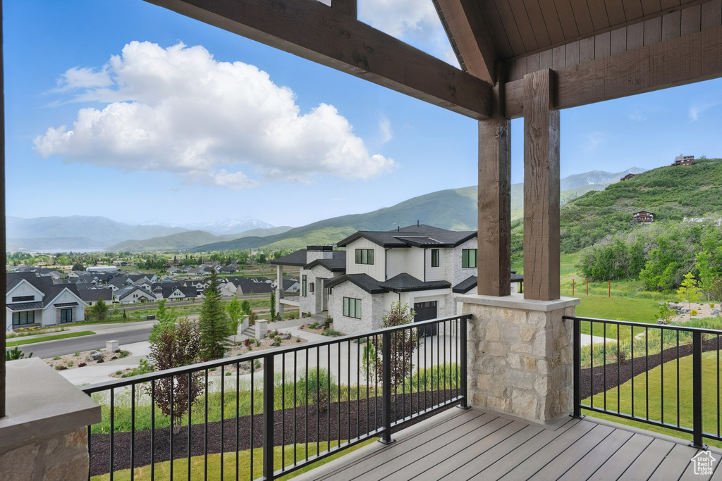 Wooden terrace with a mountain view and a residential view