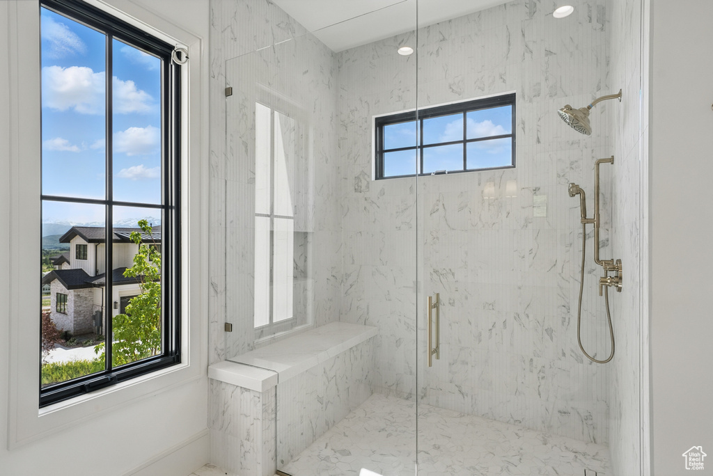 Bathroom with a marble finish shower