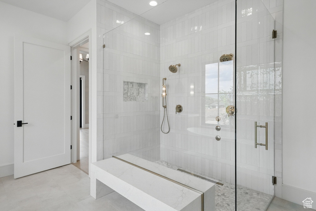 Full bathroom with a stall shower and recessed lighting