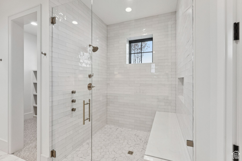 Bathroom featuring a stall shower and recessed lighting