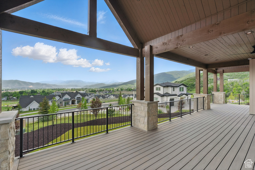 Wooden terrace with a mountain view and a residential view
