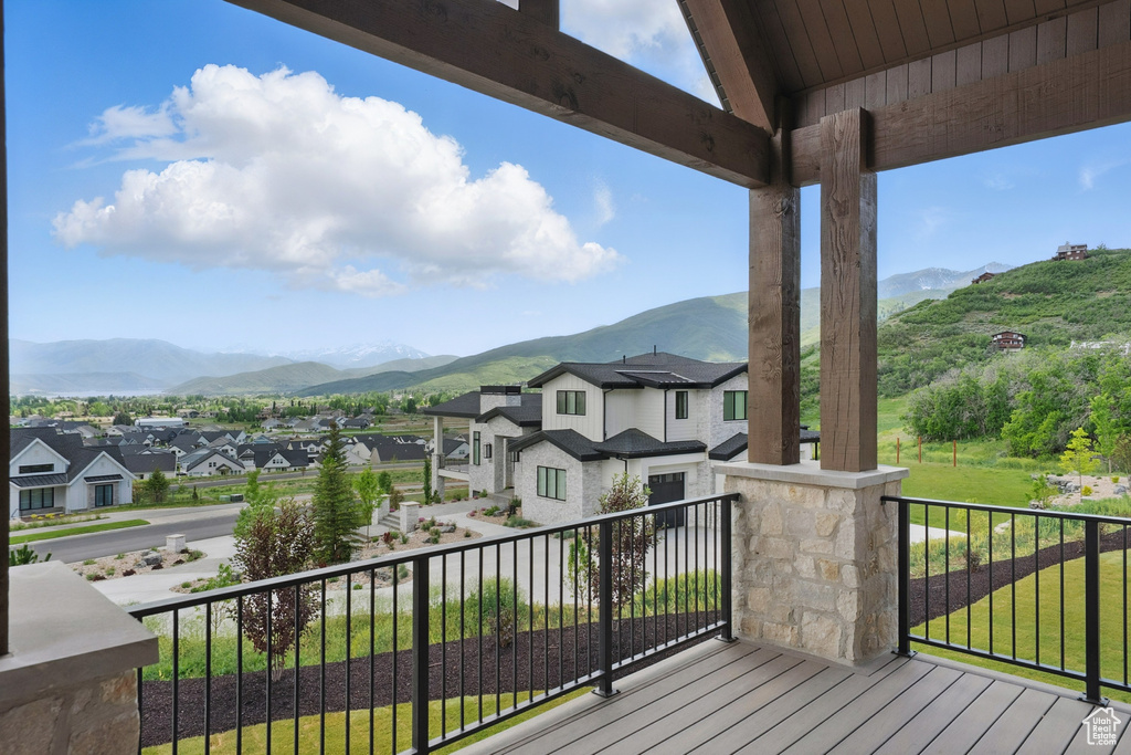 Wooden terrace with a mountain view and a residential view