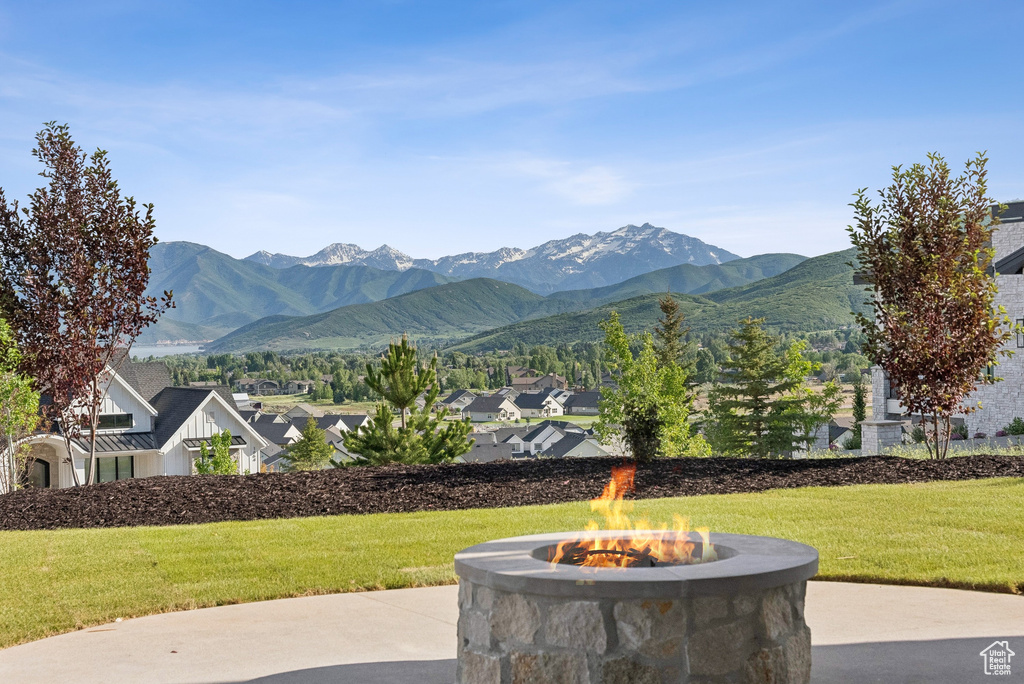 View of mountain backdrop featuring nearby suburban area