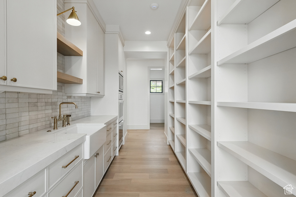 Pantry featuring a sink