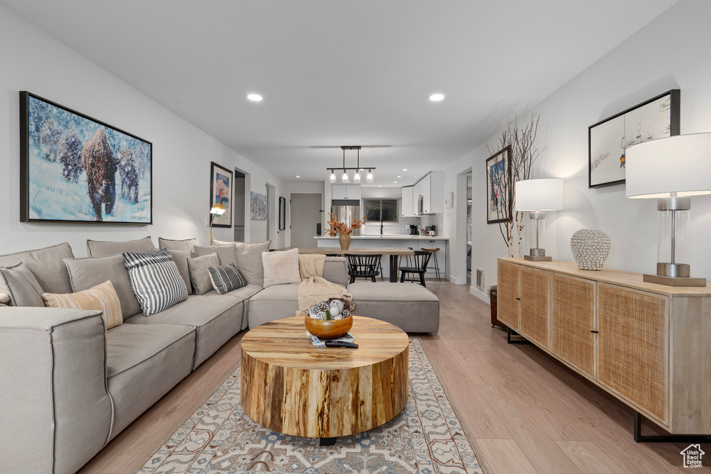 Living room with light hardwood / wood-style flooring