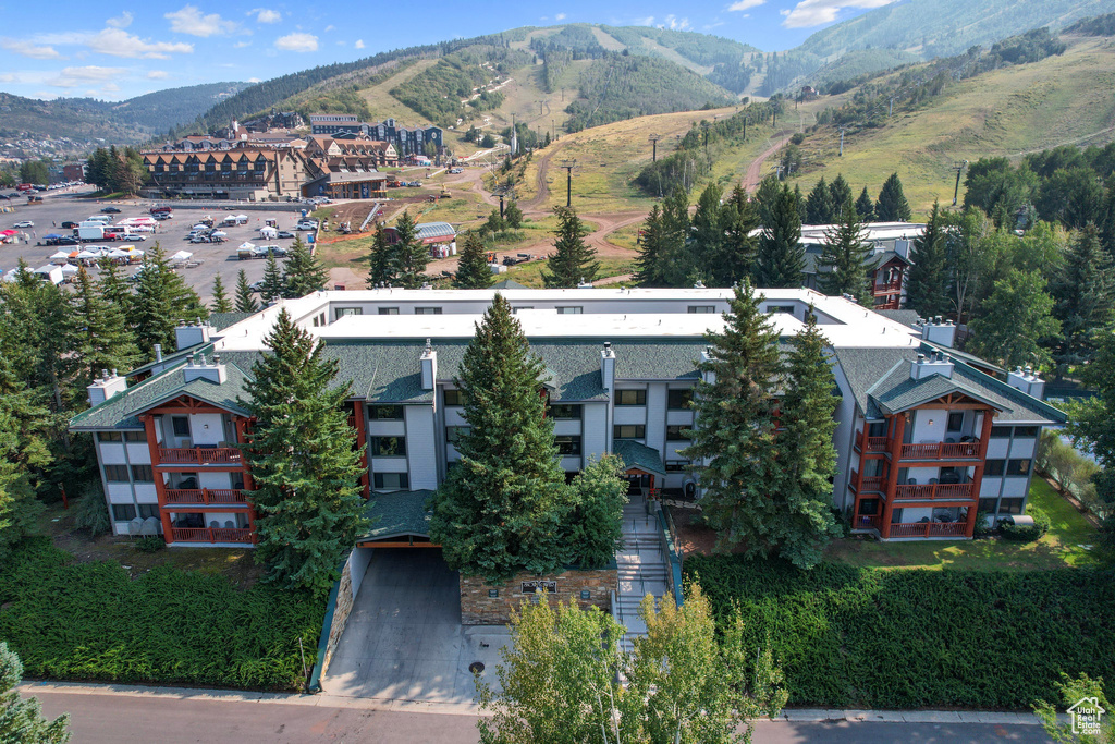 Birds eye view of property with a mountain view