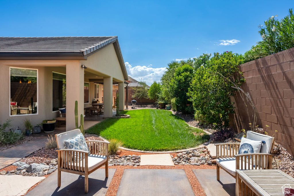 View of yard with a patio