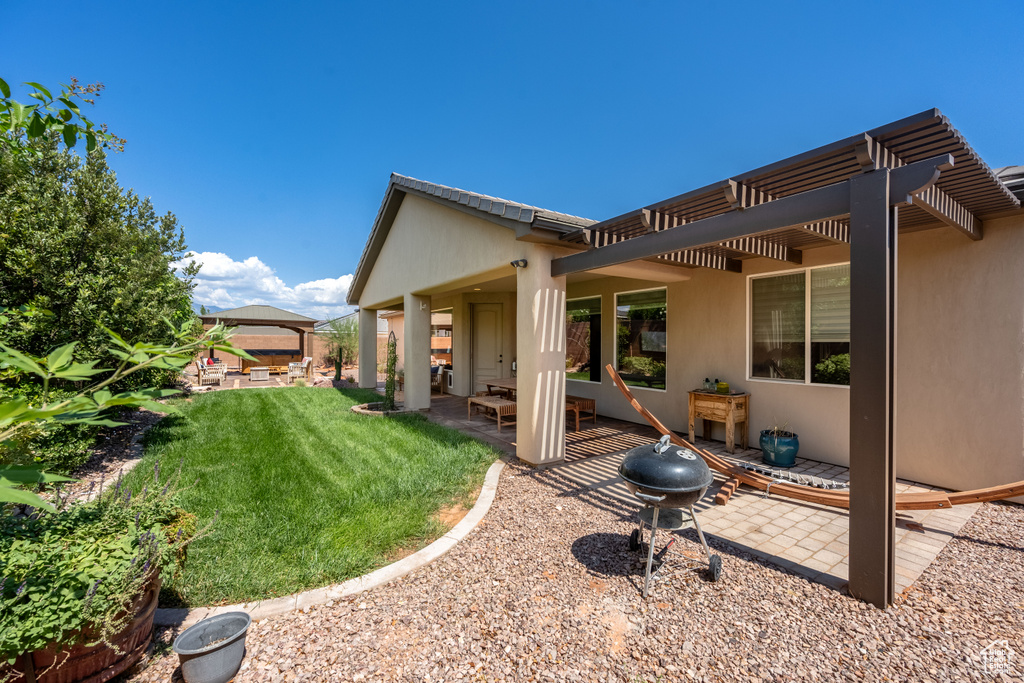 View of yard featuring a pergola and a patio area