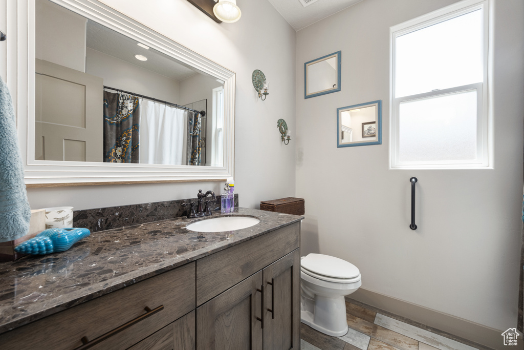 Bathroom featuring toilet and vanity