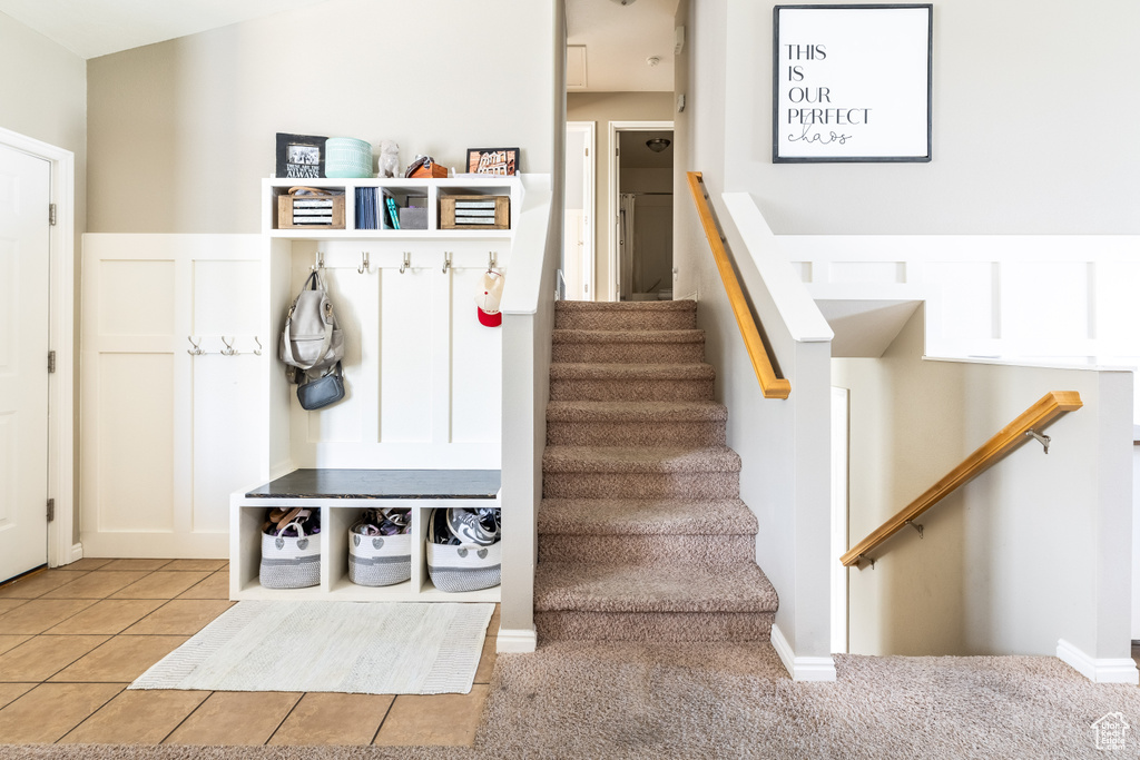 Mudroom featuring light tile patterned floors