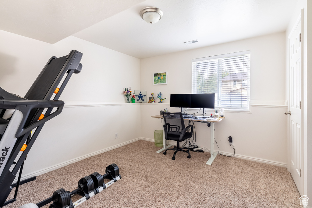 Home office with light carpet