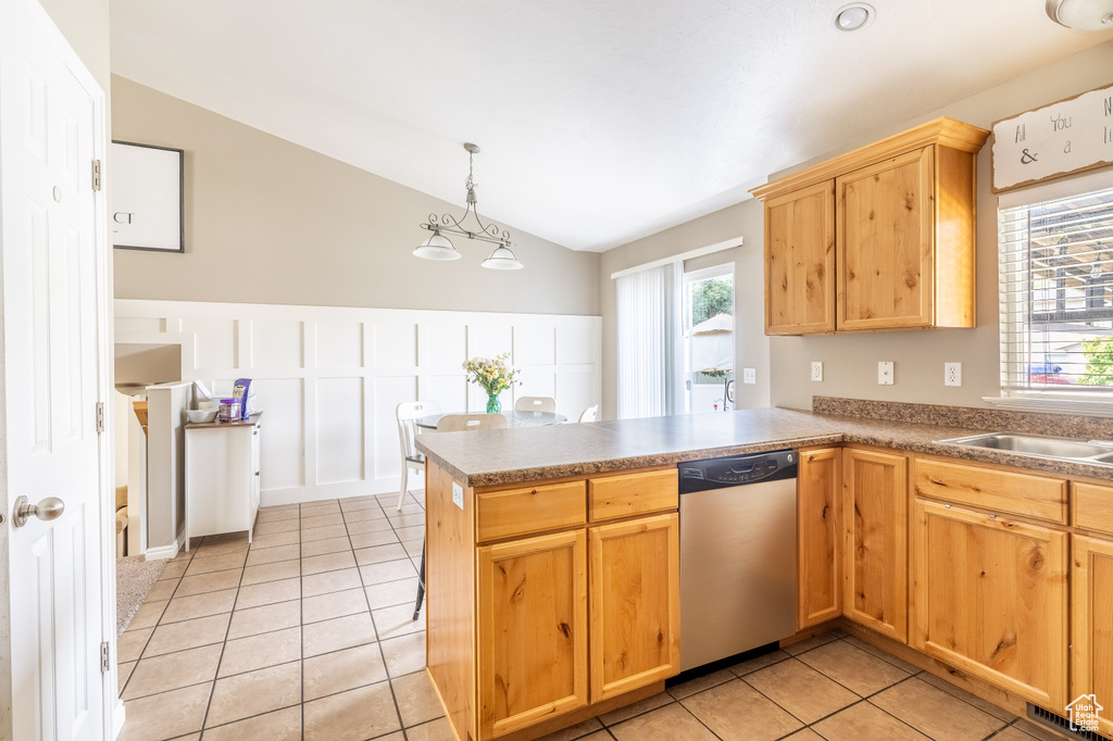 Kitchen with dishwasher, kitchen peninsula, and vaulted ceiling