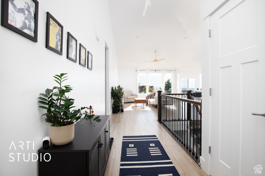 Hall with light hardwood / wood-style flooring and expansive windows