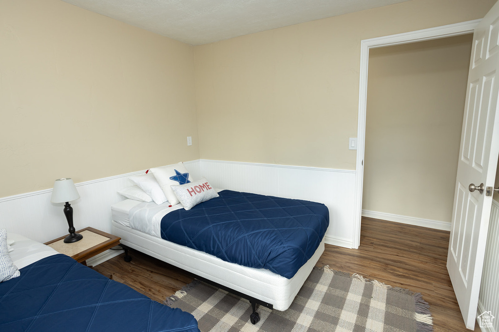 Bedroom featuring wood-type flooring