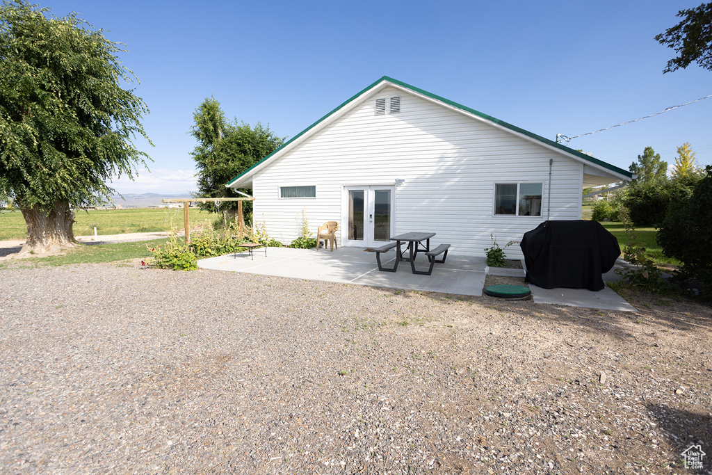 Rear view of property with a patio