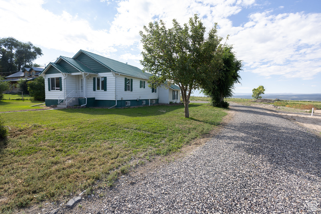 View of front of house with a front lawn