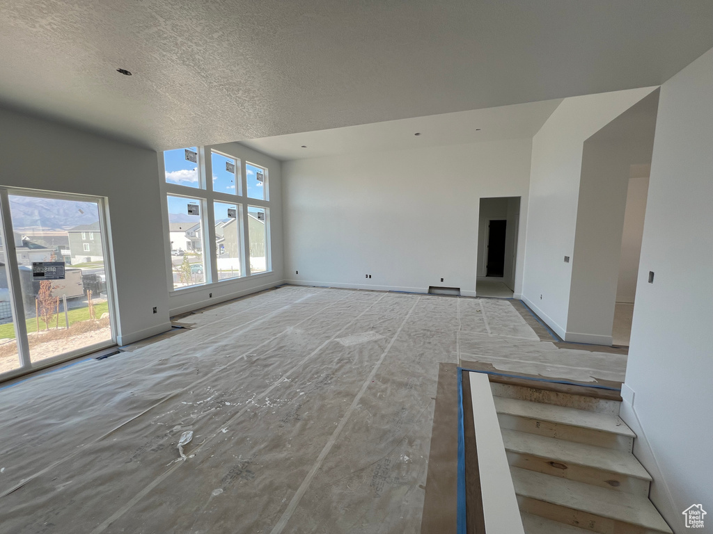 Unfurnished living room with a textured ceiling