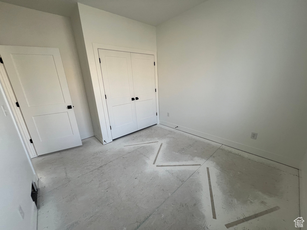 Unfurnished bedroom with a closet