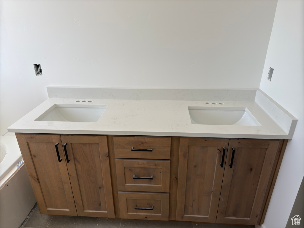 Bathroom with vanity and tile patterned floors