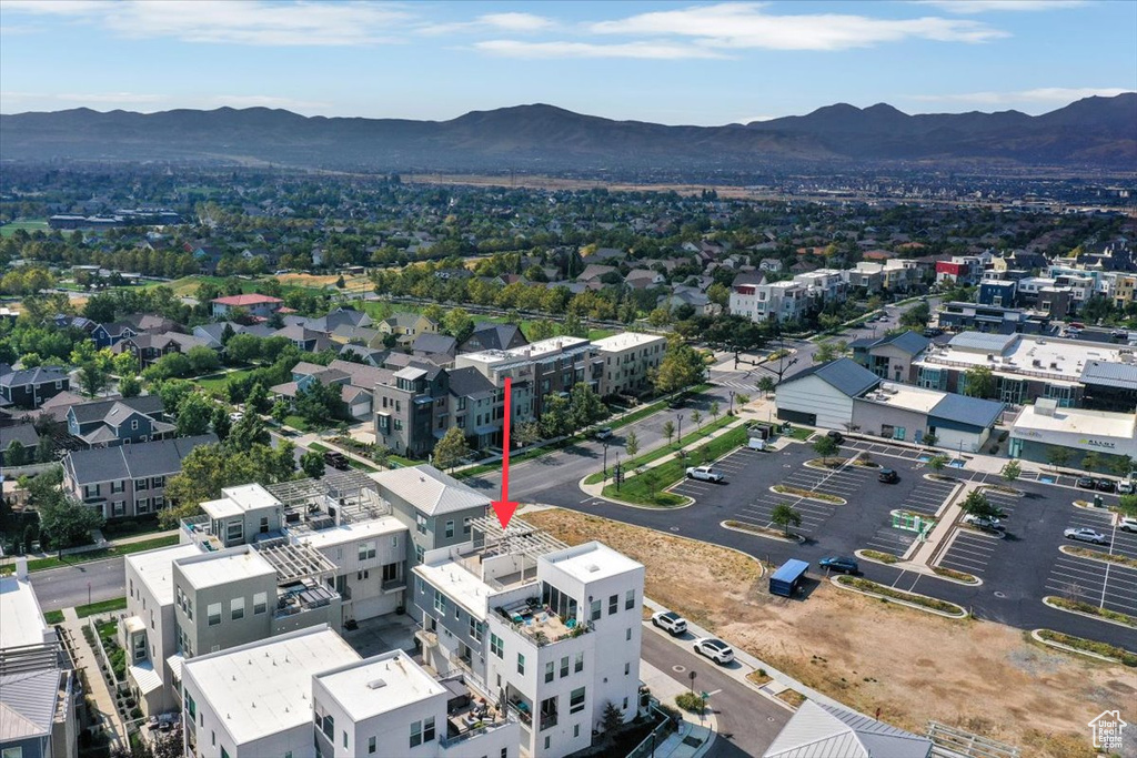 Birds eye view of property with a mountain view