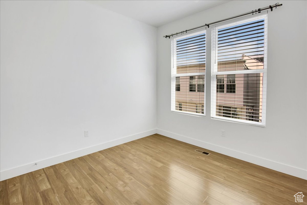 Spare room featuring light wood-type flooring