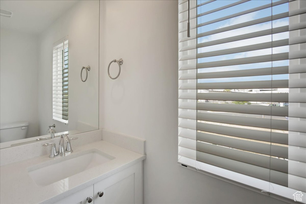 Bathroom with toilet and vanity