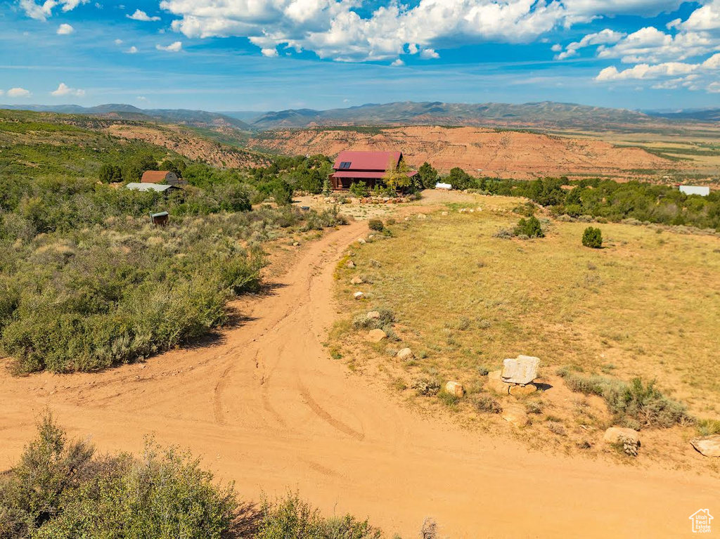 Birds eye view of property with a mountain view and a rural view